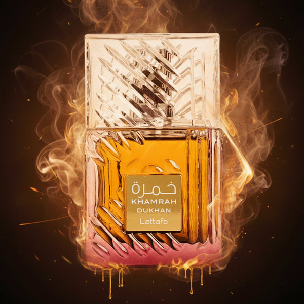A bottle of Lattafa Khamrah Dukhan perfume with a textured glass design and amber-colored liquid.