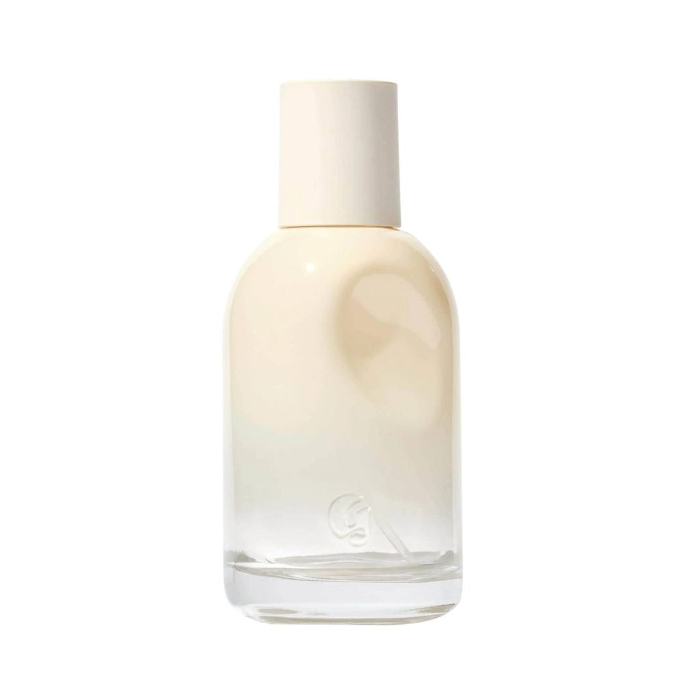 Glossier You Doux fragrance bottle with a cream cap and a clear glass base.