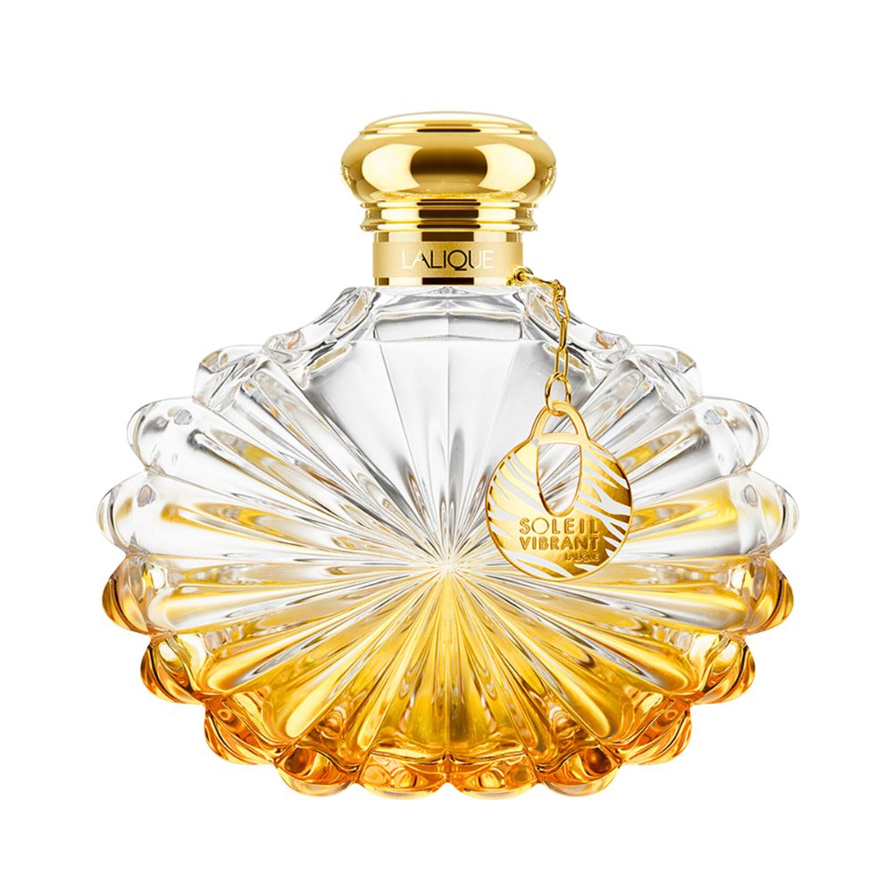 Lalique Soleil Vibrant perfume bottle with gold accents and a decorative charm.