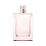 A light pink Burberry Brit Sheer perfume bottle with a ribbed cap.
