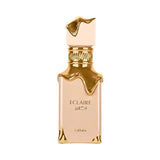 A beige perfume bottle with gold accents and the name ECLAIRE.