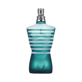 Le Male perfume bottle shaped like a torso with blue and white stripes.