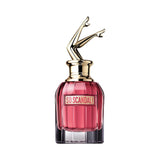 Jean Paul Gaultier So Scandal! perfume bottle with gold legs on top.