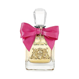 A clear glass perfume bottle with a pink bow and gold "Juicy Couture" emblem.