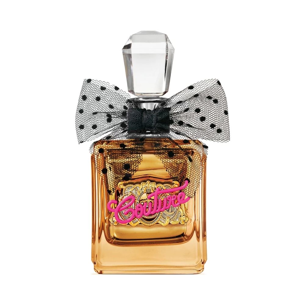 A gold bottle of Viva La Juicy Gold Couture perfume with a black polka dot bow.