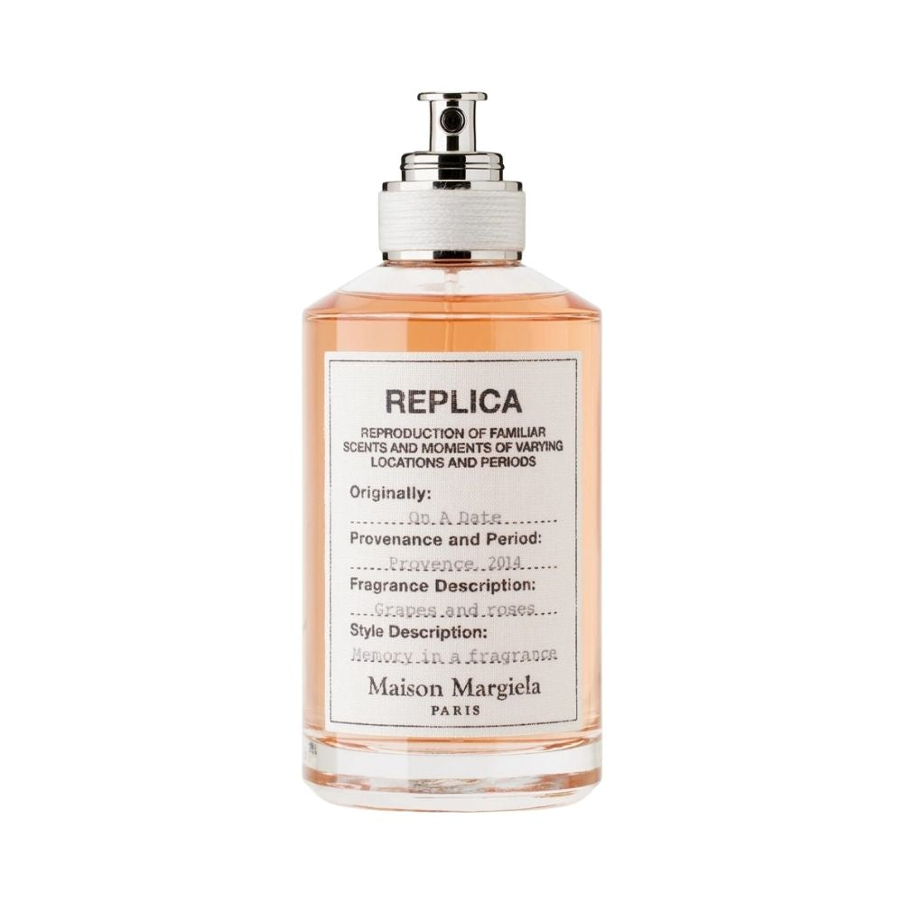 Maison Margiela REPLICA On A Date perfume bottle with pink liquid.