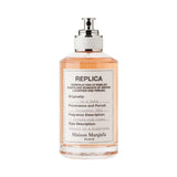 Maison Margiela REPLICA On A Date perfume bottle with pink liquid.