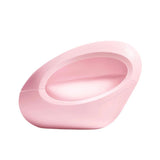 A pink, oval-shaped perfume bottle with "ariana grande" embossed on the side.