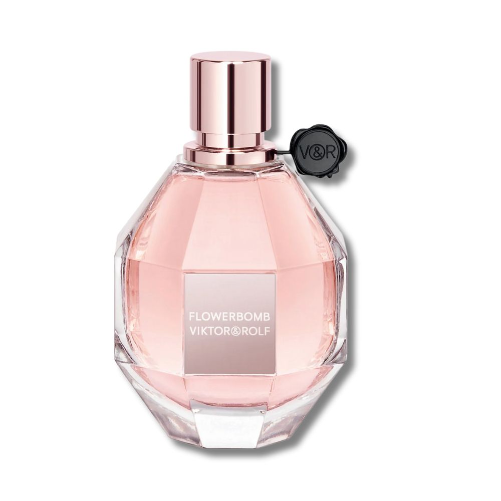 Viktor & Rolf Flowerbomb perfume in a faceted pink glass bottle with a rose gold cap.